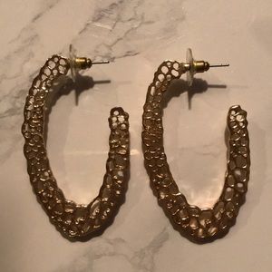 Large gold coloured earrings